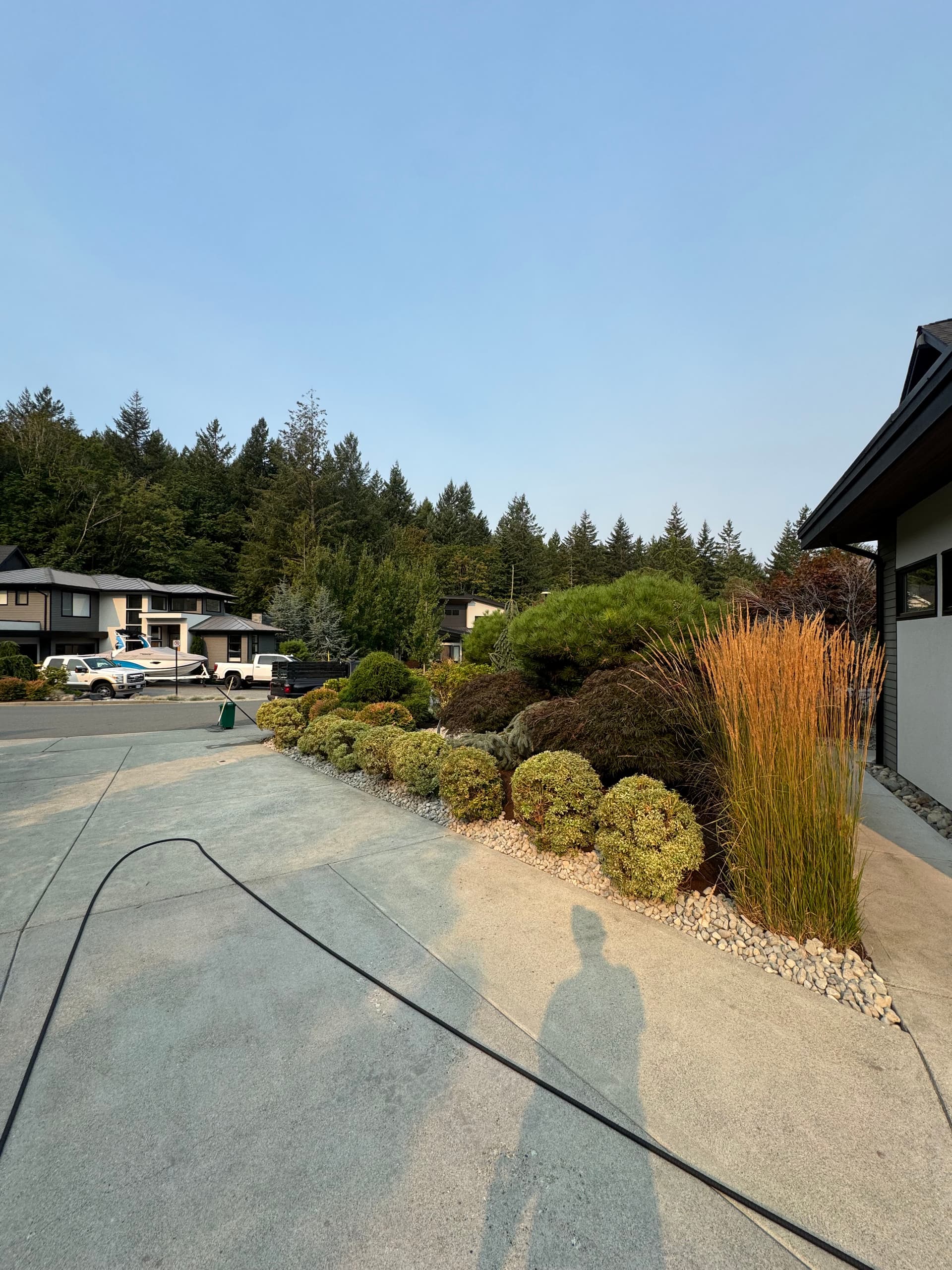 River Rock Borders and Summer Shrub Pruning Done Right