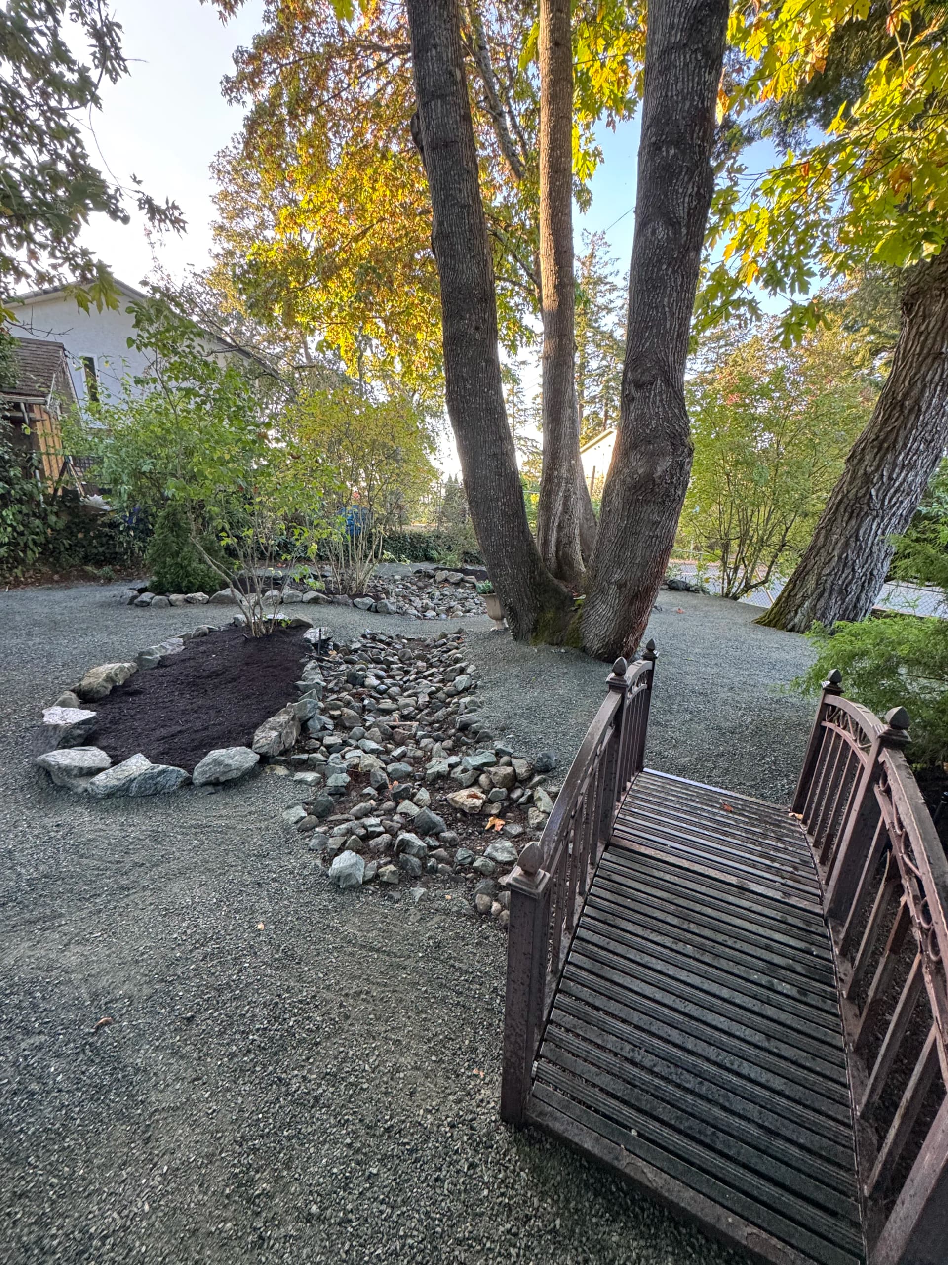 Rock Borders, River Stone Channels and a Fresh Garden Bed Done Right image