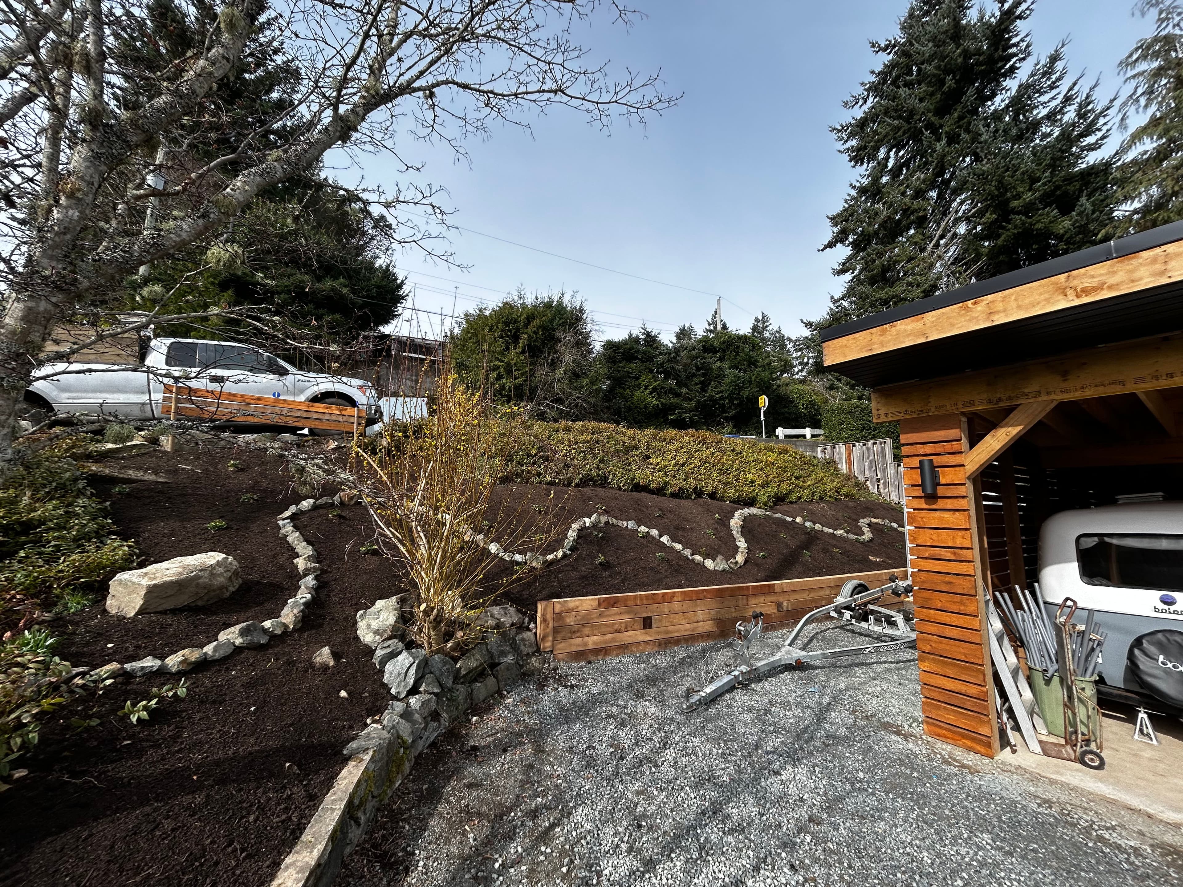Project Backyard Overhaul with Retaining Walls and Mulch image