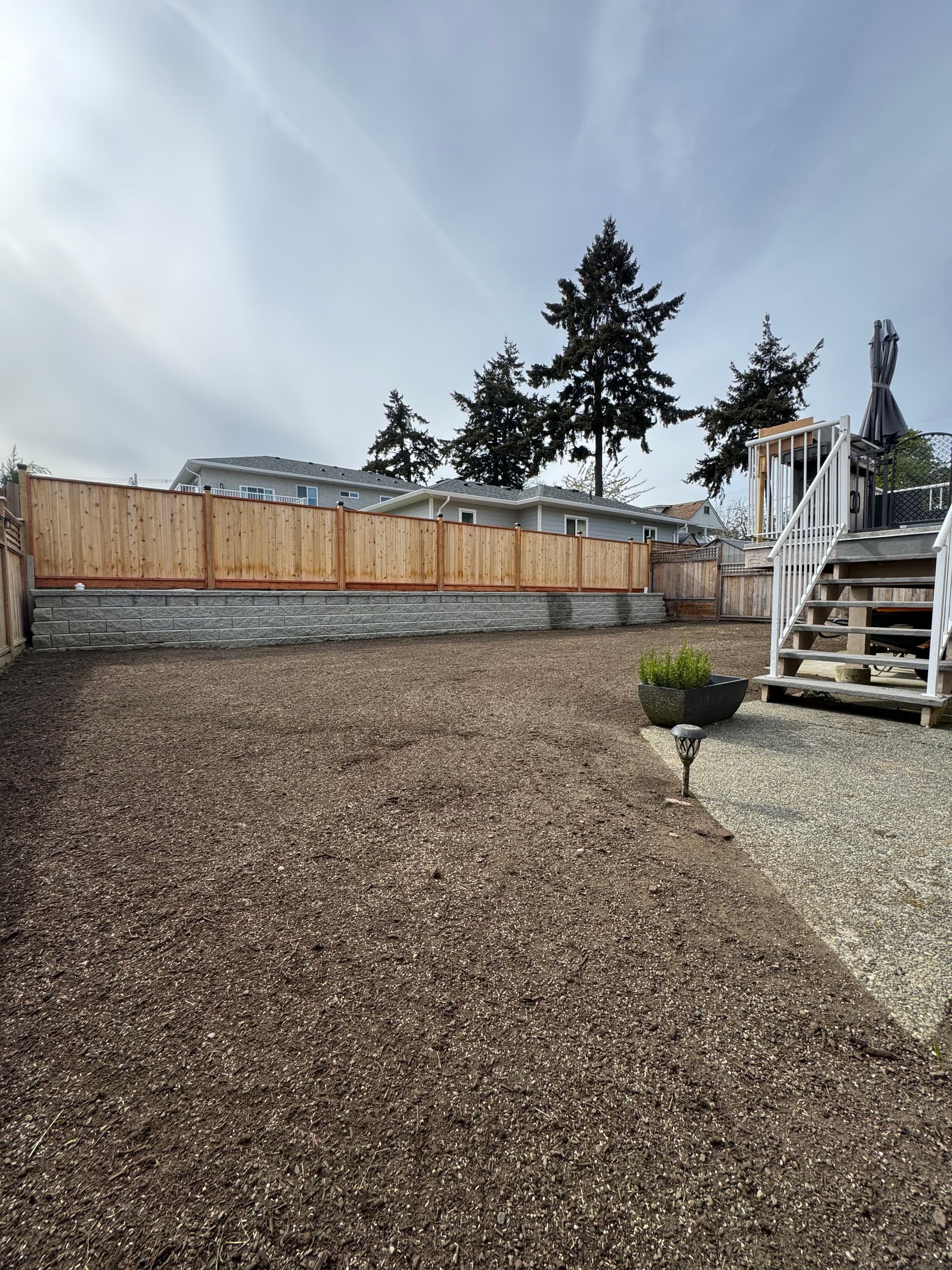 Bare Dirt Backyard Gets a Full Soil and Sod Overhaul image