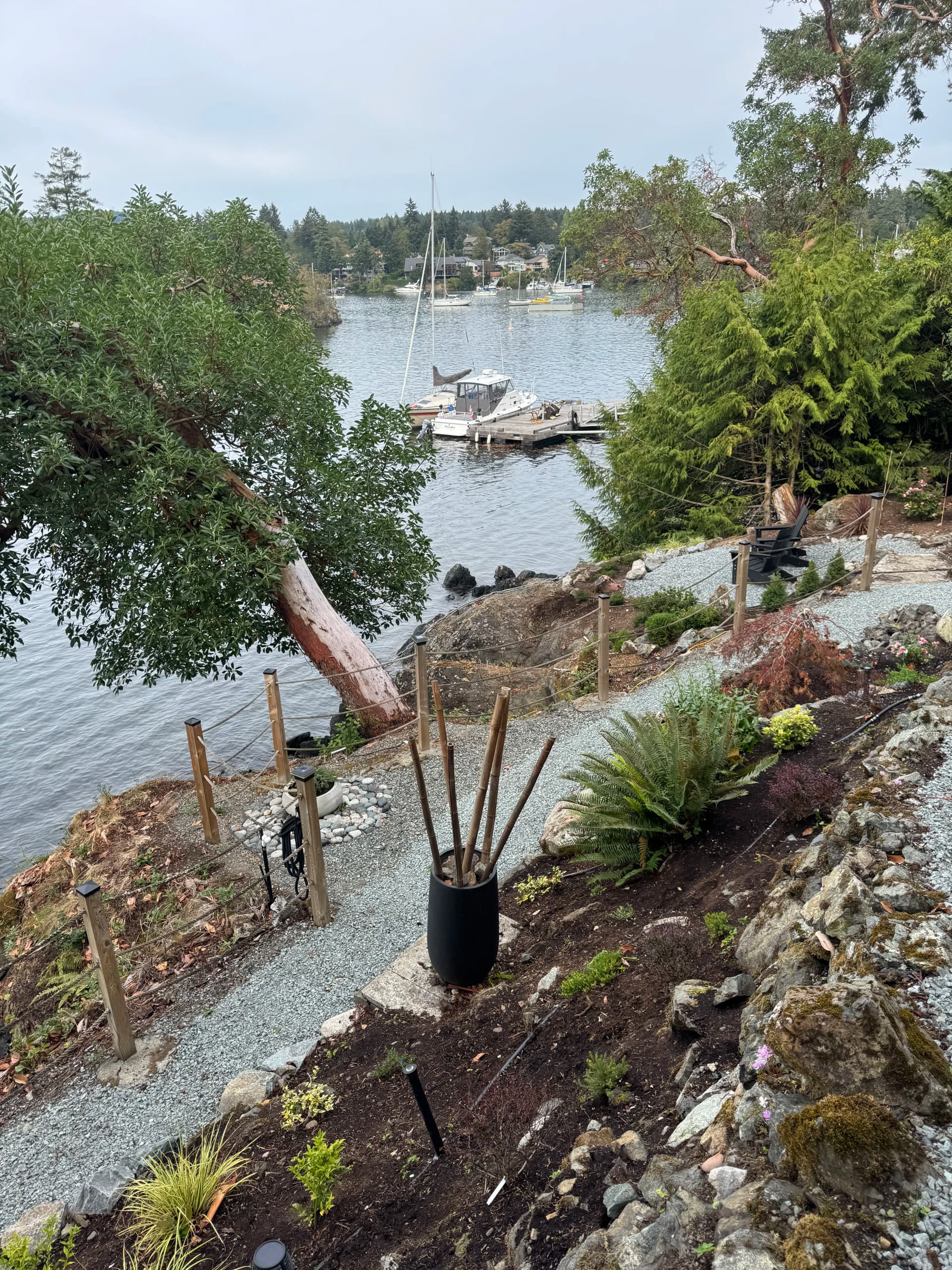 Waterfront Landscape Installation with Natural Garden Beds and Gravel Pathways image