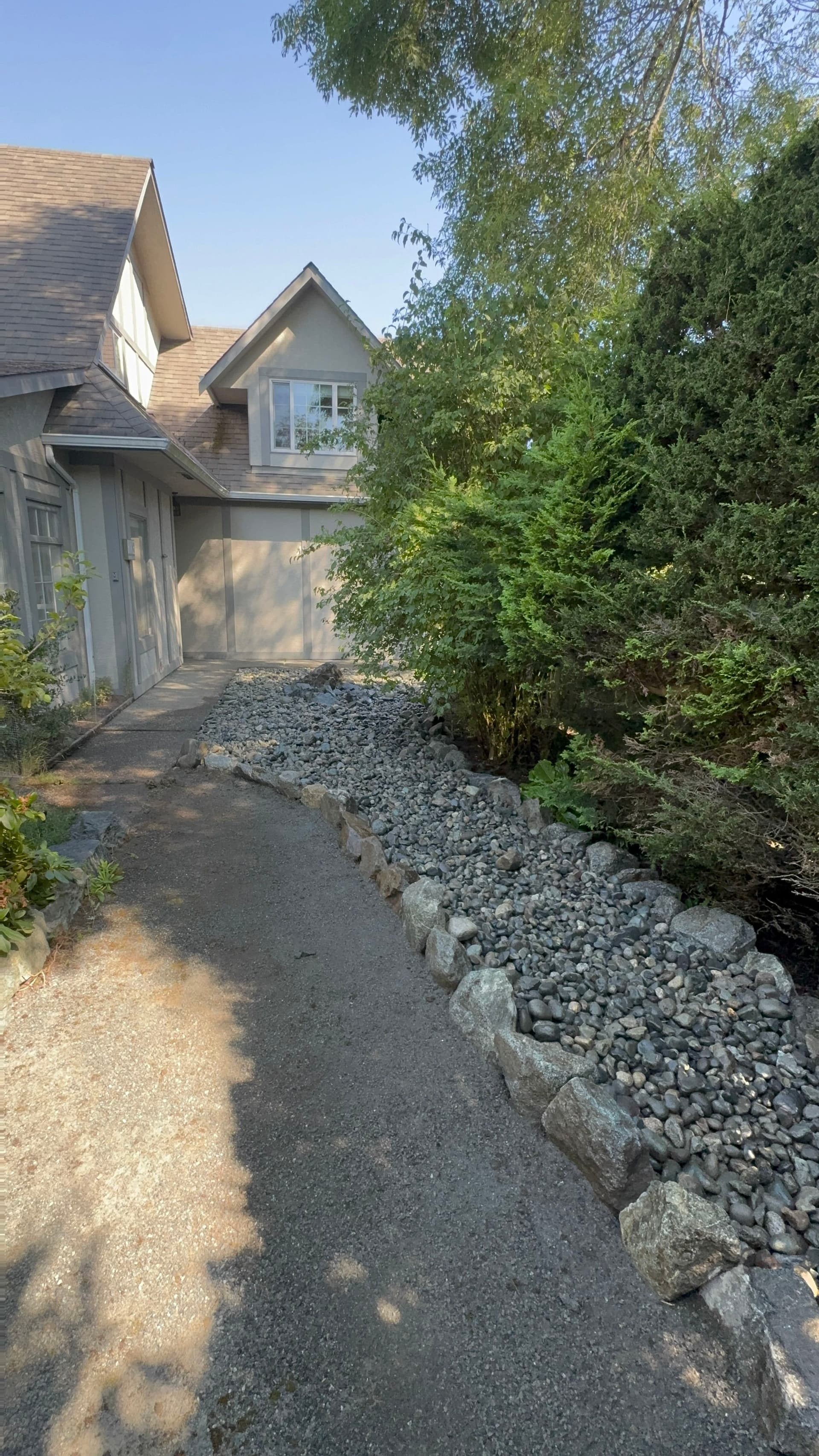 Gallery photos for Garden Bed Replaced With a Clean River Rock Feature: Image #1