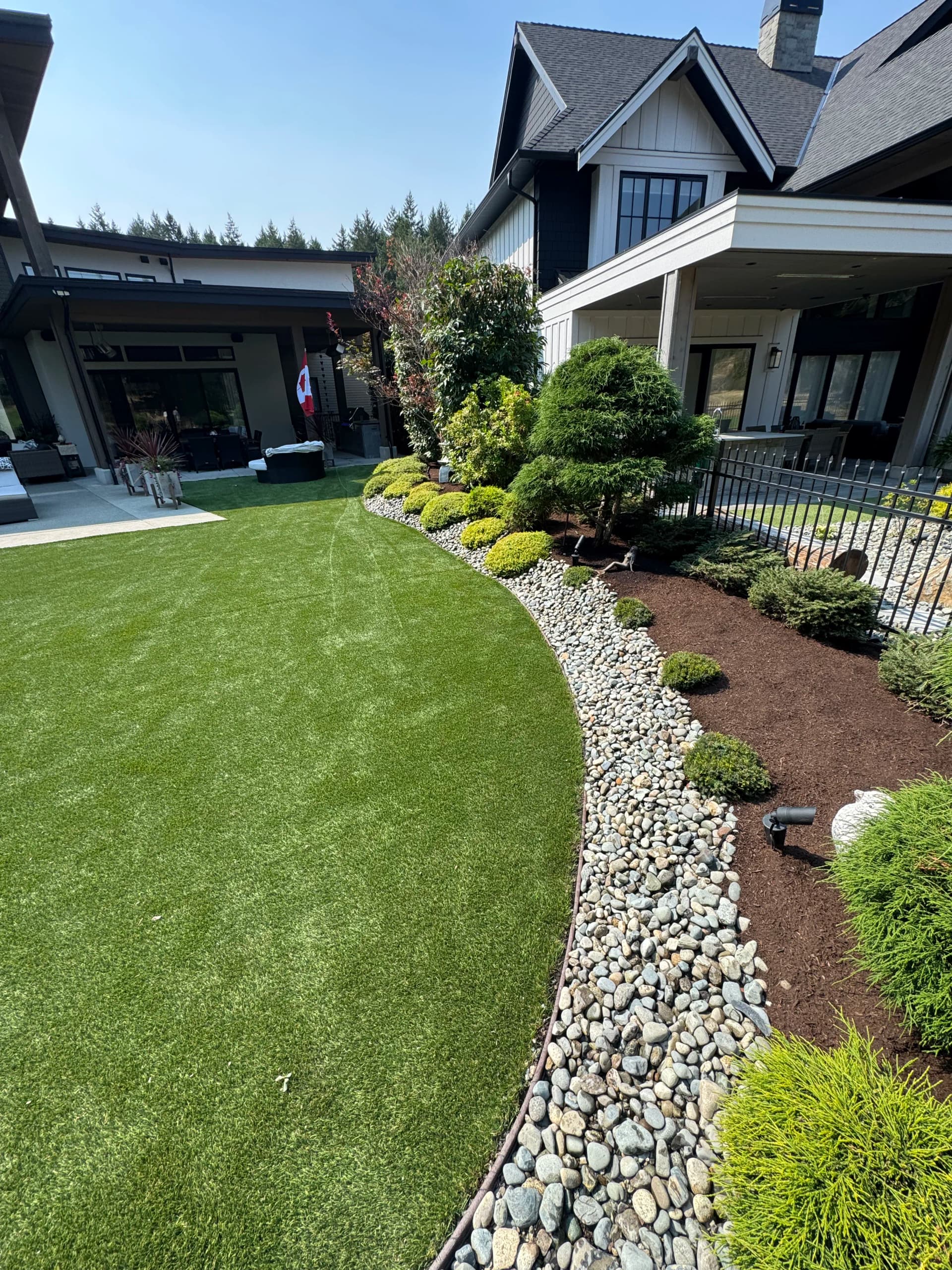 Gallery photos for River Rock Edging That Keeps Landscape Beds Looking Sharp: Image #1